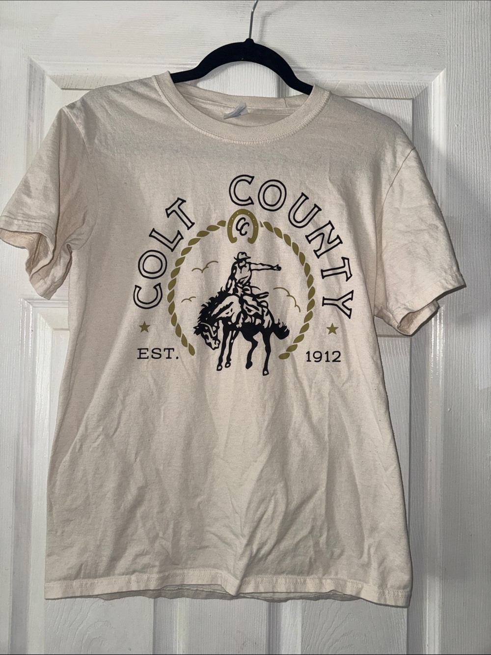 Colt County Graphic Tee - Cream with Black & Gold Print